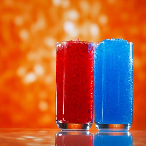 Two glasses filled with red and blue liquid against an orange background