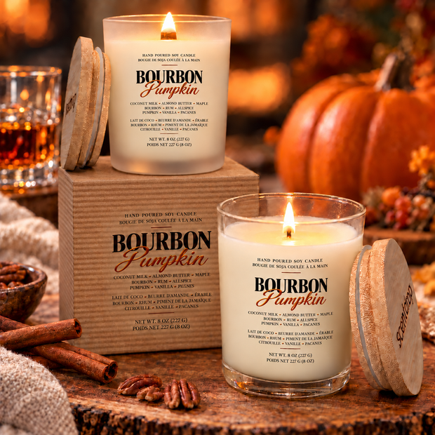 Bourbon Pumpkin candles in a fall scene with pumpkins and cozy background.