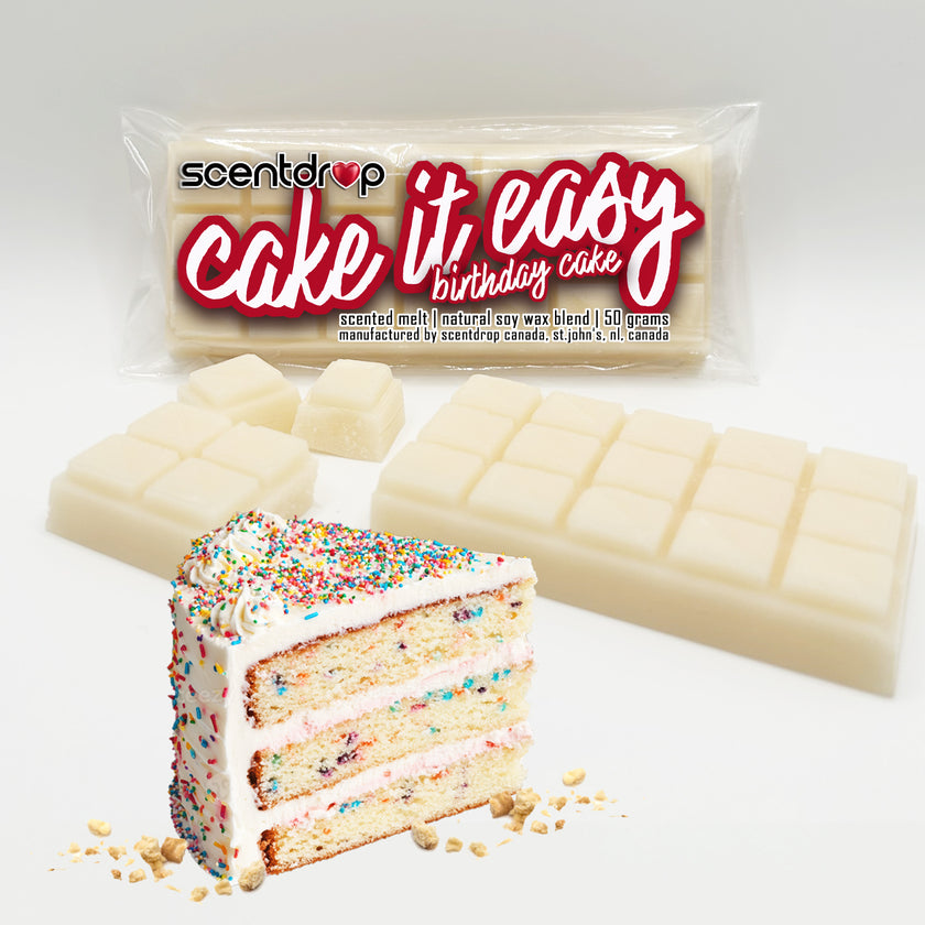 Scented wax bar with 'cake it easy' packaging and a slice of birthday cake on a white background