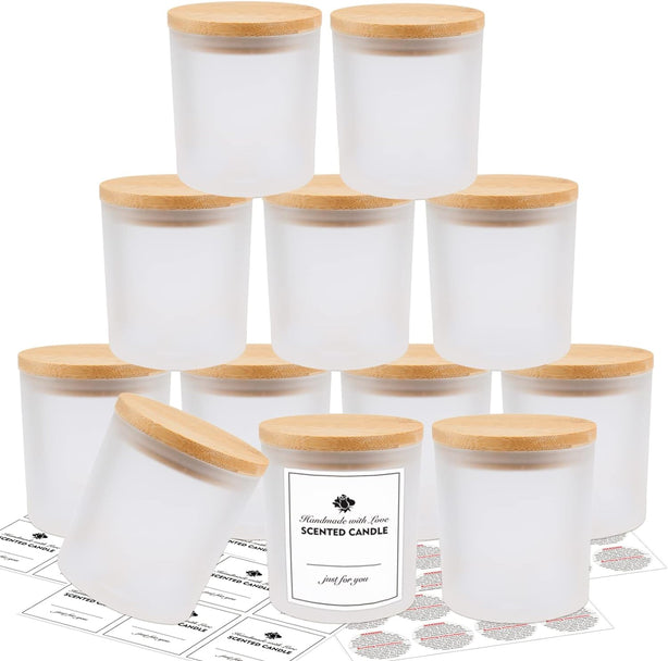 Set of white scented candles with wooden lids on a white background