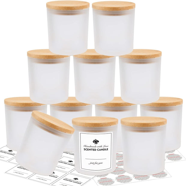 Set of white scented candles with wooden lids on a white background
