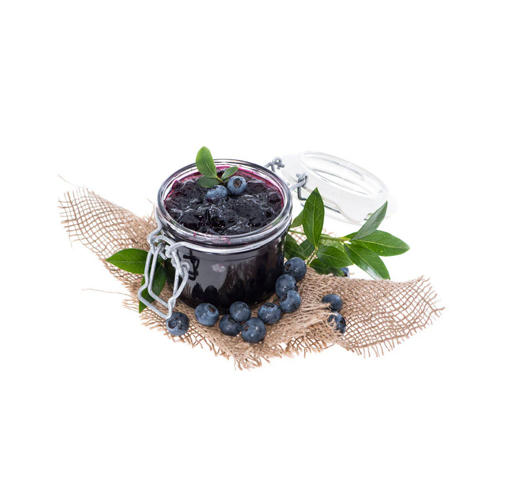 Jar of blueberry jam with fresh blueberries on a white background