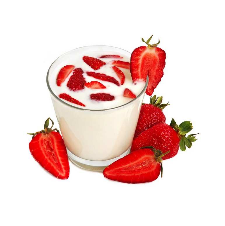 Glass of milk with sliced strawberries on a white background