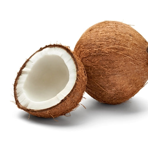 Coconut with one half cut open on a white background