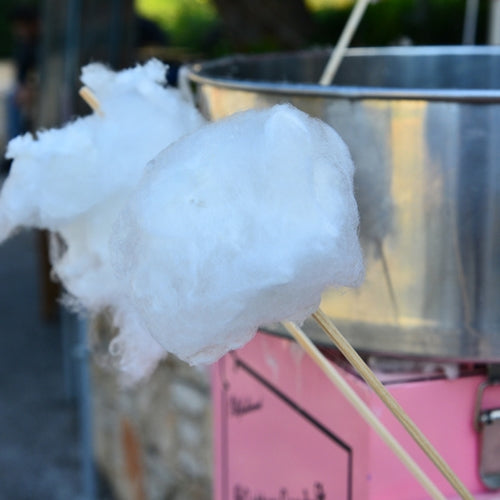 Cotton candy on a stick with a blurred background