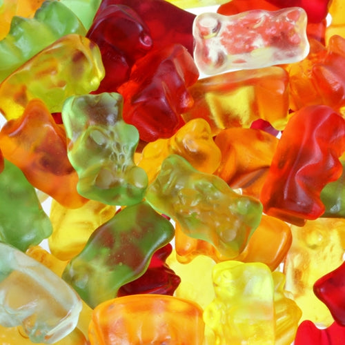 Colorful gummy bears in various shapes and sizes.