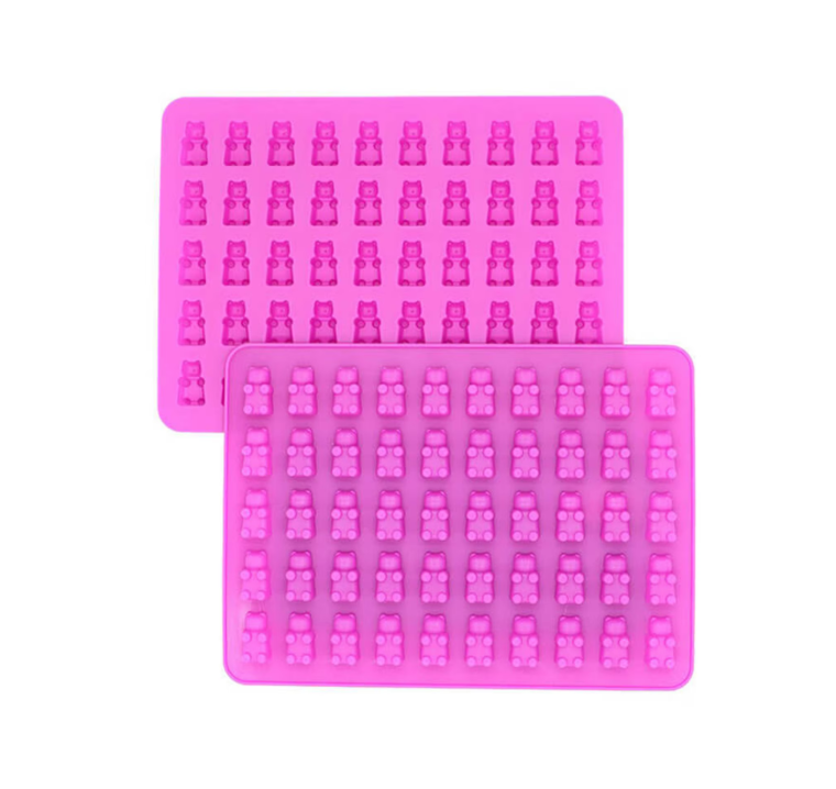 Two pink silicone molds with bear shapes on a white background.