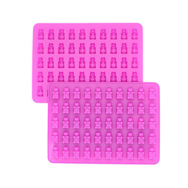 Two pink silicone molds with bear shapes on a white background.
