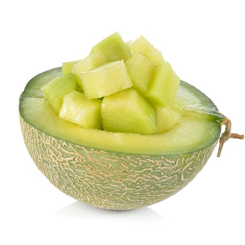 Halved melon with chunks of melon on a white background