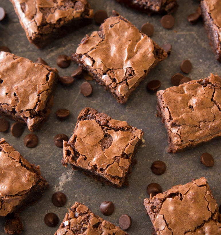 Brownies with chocolate chips on a gray surface