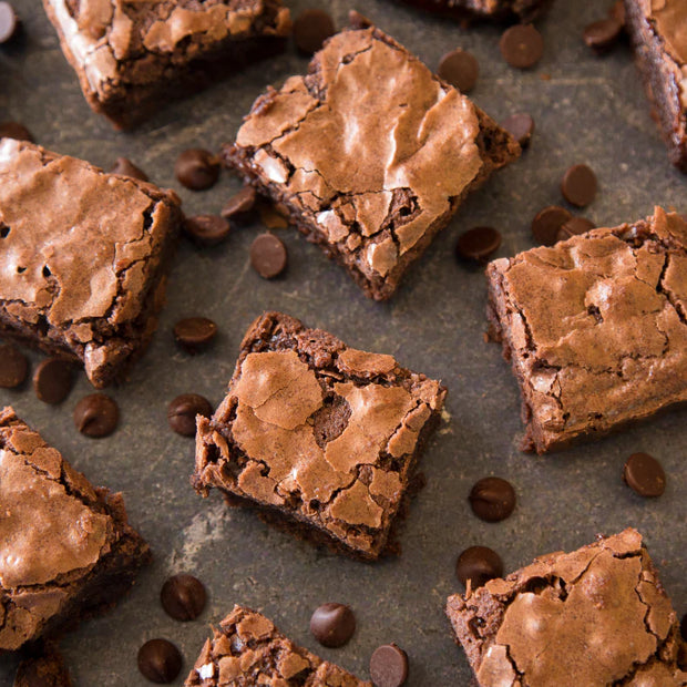 Brownies with chocolate chips on a gray surface