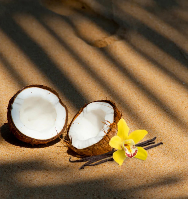 A split coconut on a beige background.