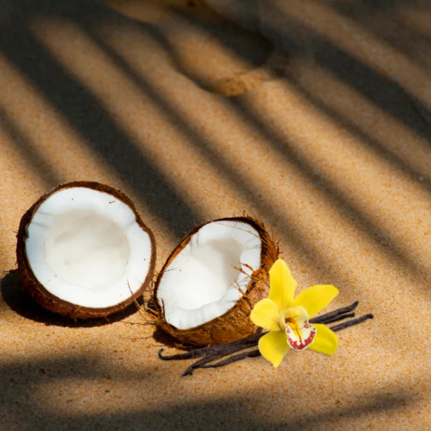 A split coconut on a beige background.