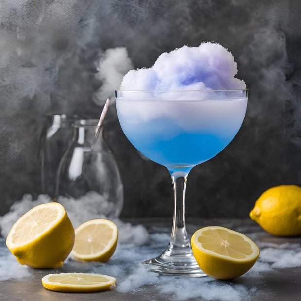 Cotton candy in a glass with lemons on a grey background.