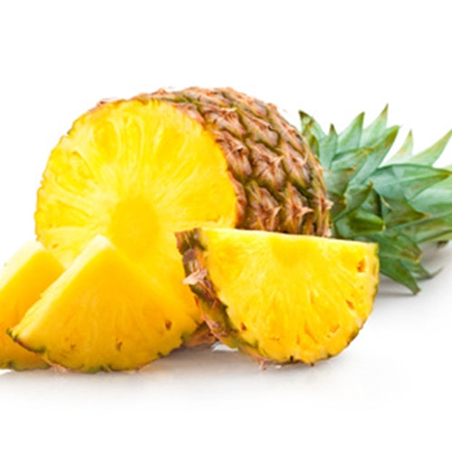 Whole pineapple with a slice on a white background