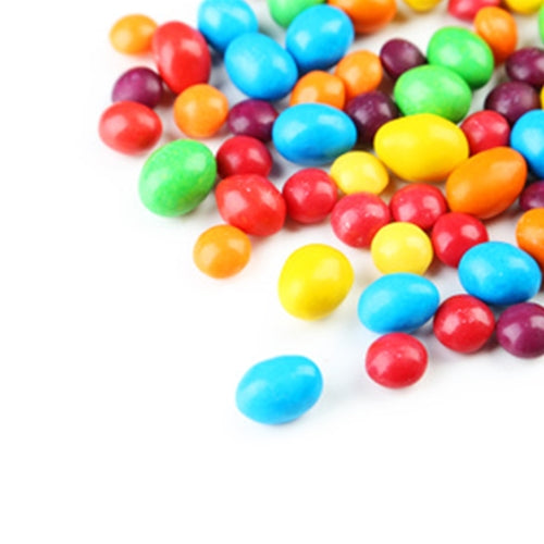 Assorted colorful jelly beans on a white background