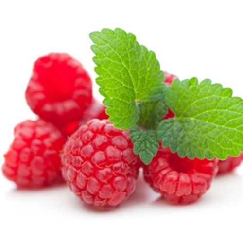 Red raspberries with green leaves on a white background