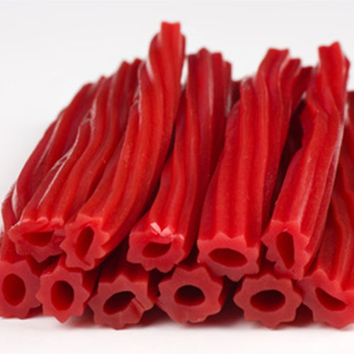 Red licorice sticks on a white background