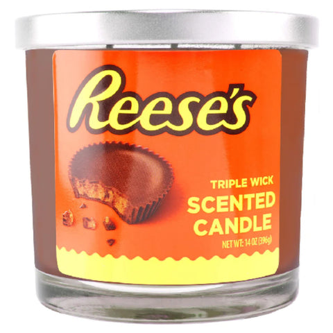 Reese's scented candle with orange label and silver lid on a white background 14oz.