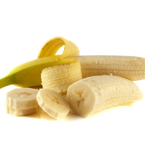 Sliced bananas with a whole banana on a white background