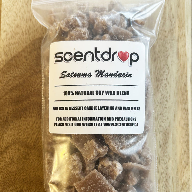 Packaged Satsuma Mandarin soy wax blend with Scentdrop label on a wooden surface