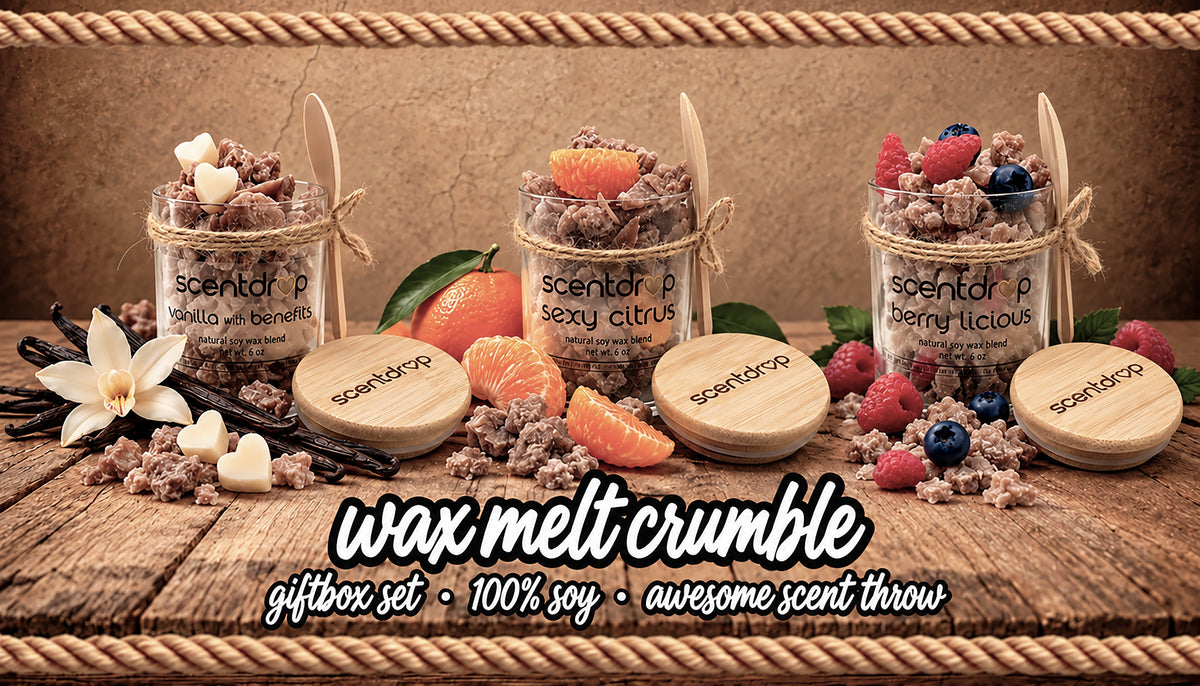 Three small glass jars filled with wax melt crumble are arranged on a rustic wooden surface with fruit, flowers, and vanilla beans. The jars have wooden lids and visible labels reading scentor P, Vanilla + Benefits, Sexy Citrus, and Cherry Licious.