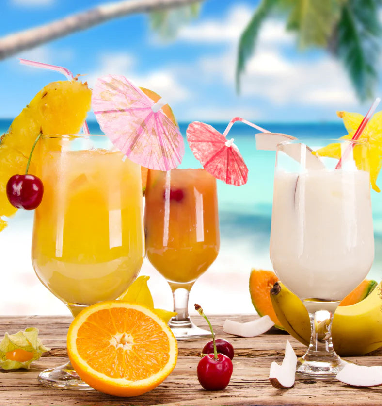 Tropical drinks with fruits on a beach setting