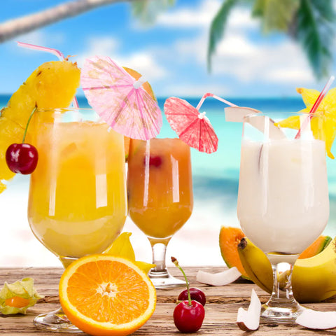 Tropical drinks with fruits on a beach setting