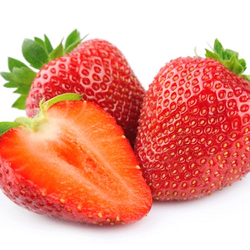 Strawberries with one sliced open on a white background