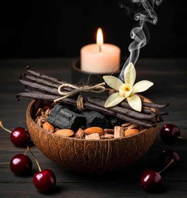 A bowl of ember wood and vanilla with a light candle on a dark background.