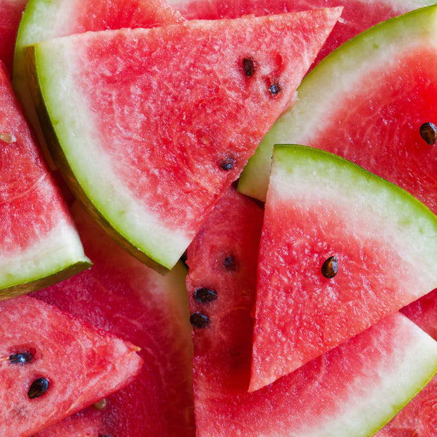 Close-up of sliced watermelon pieces with a bright red flesh and green rind.